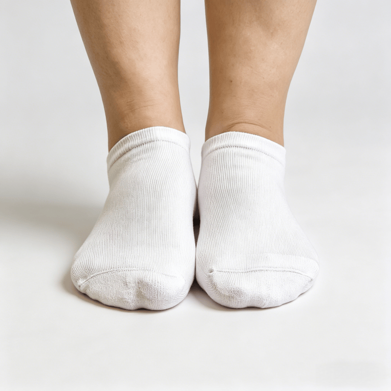 White diabetic no-show socks with heel grip strips and invisible edge to prevent slipping during walking