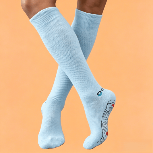 Therapeutic light blue DiaFlow™ pressure point socks designed for natural edema reduction and daily foot care