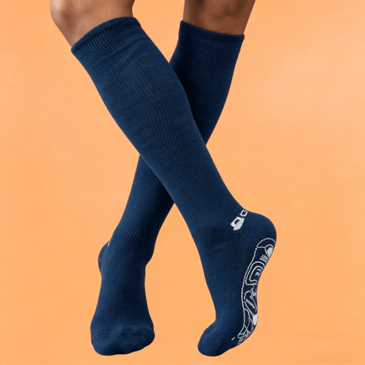 Therapeutic navy blue DiaFlow™ pressure point socks designed for natural edema reduction and daily foot care
