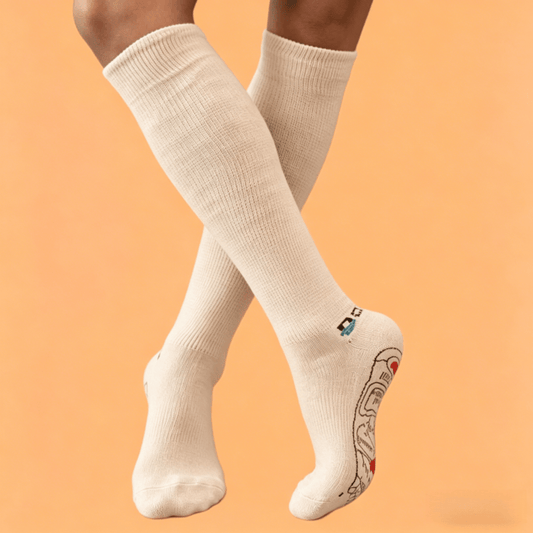 Therapeutic sand-colored DiaFlow™ pressure point socks designed for natural edema reduction and daily foot care
