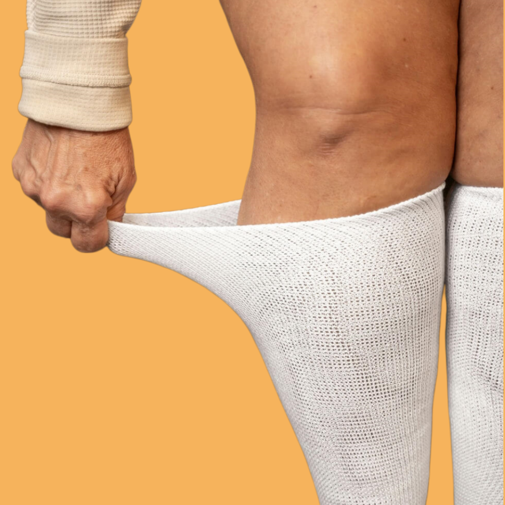 Therapeutic acupressure socks in White – non-invasive nerve stimulation for peripheral neuropathy pain relief.