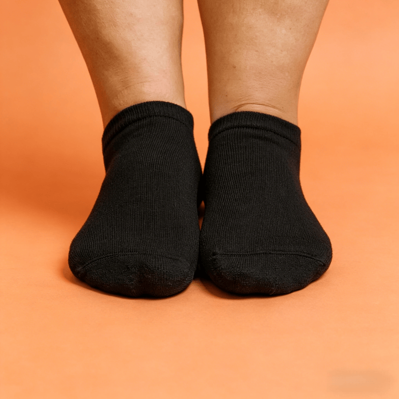 Solid black low cut acupressure socks for nerve pain relief