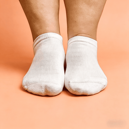Solid white low cut acupressure socks for nerve pain foot relief